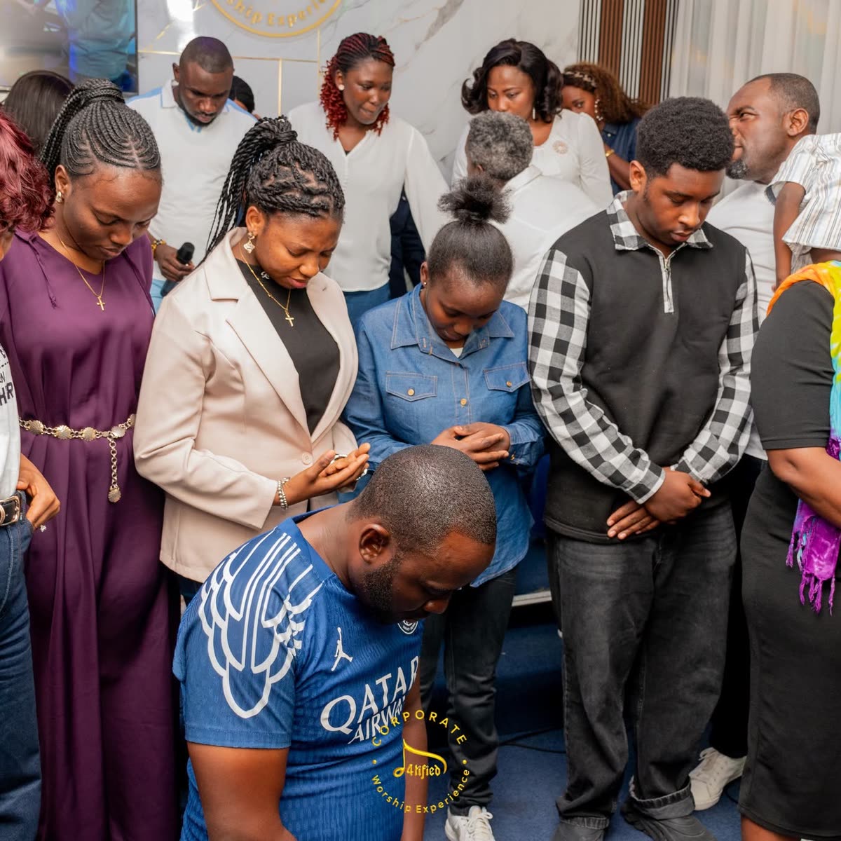 Members of the congregation standing together during a Corporate Worship Experience
